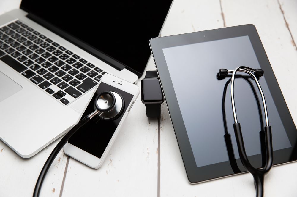 Laptop, tablet and phone lined up for diagnostics