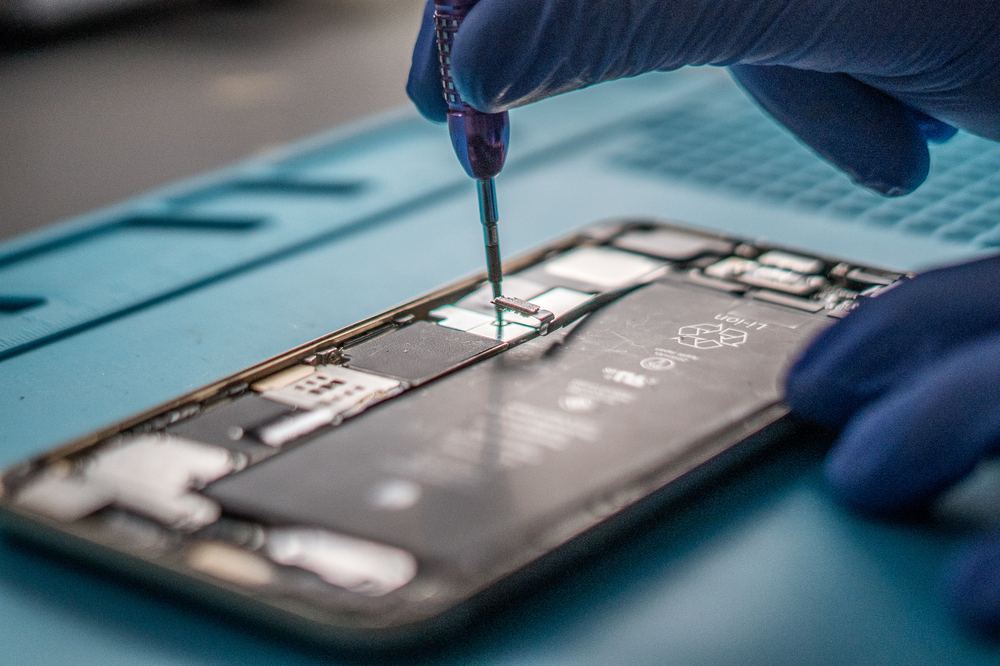 Removing the screws from the back of a phone